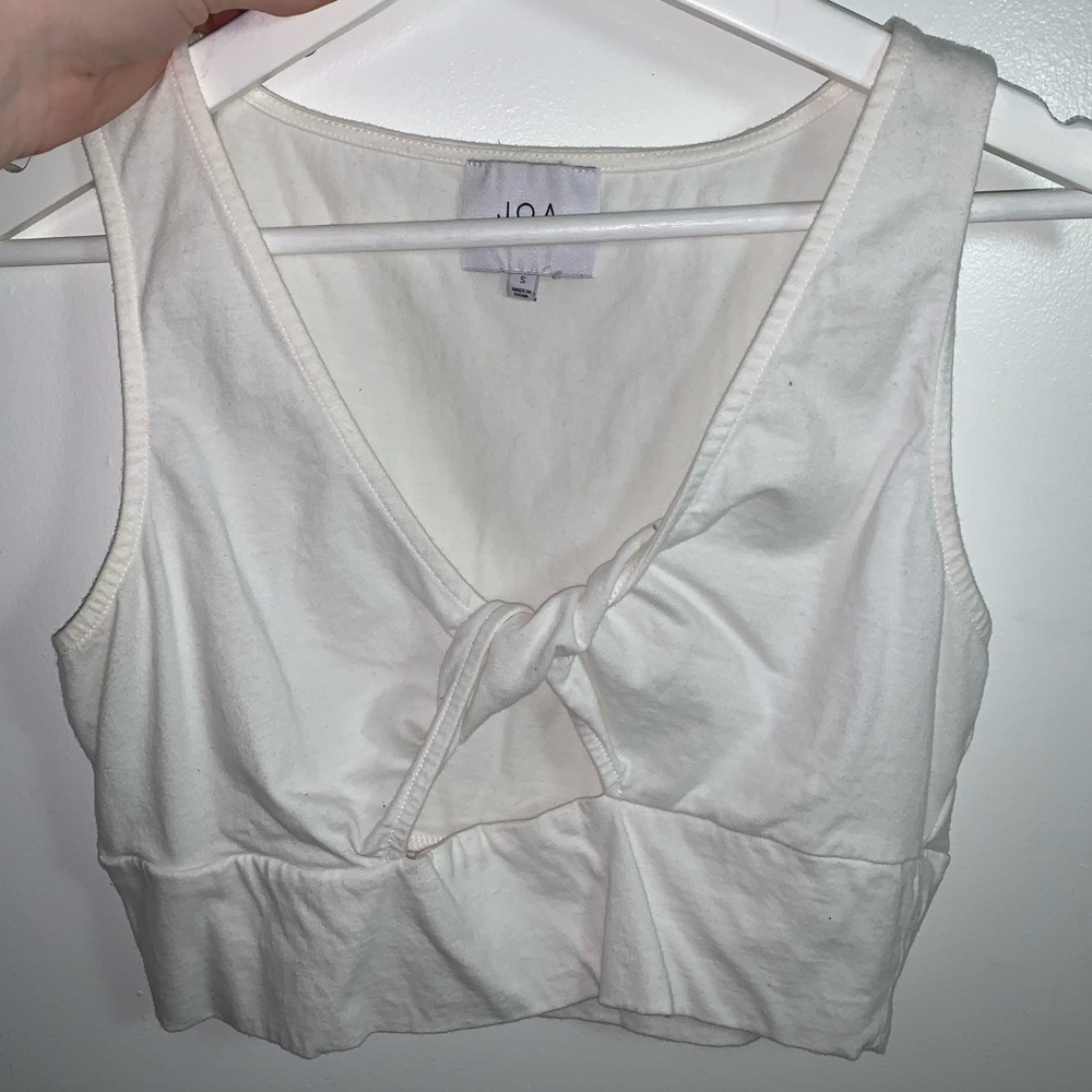 White crop top with peak a boo hole in middle